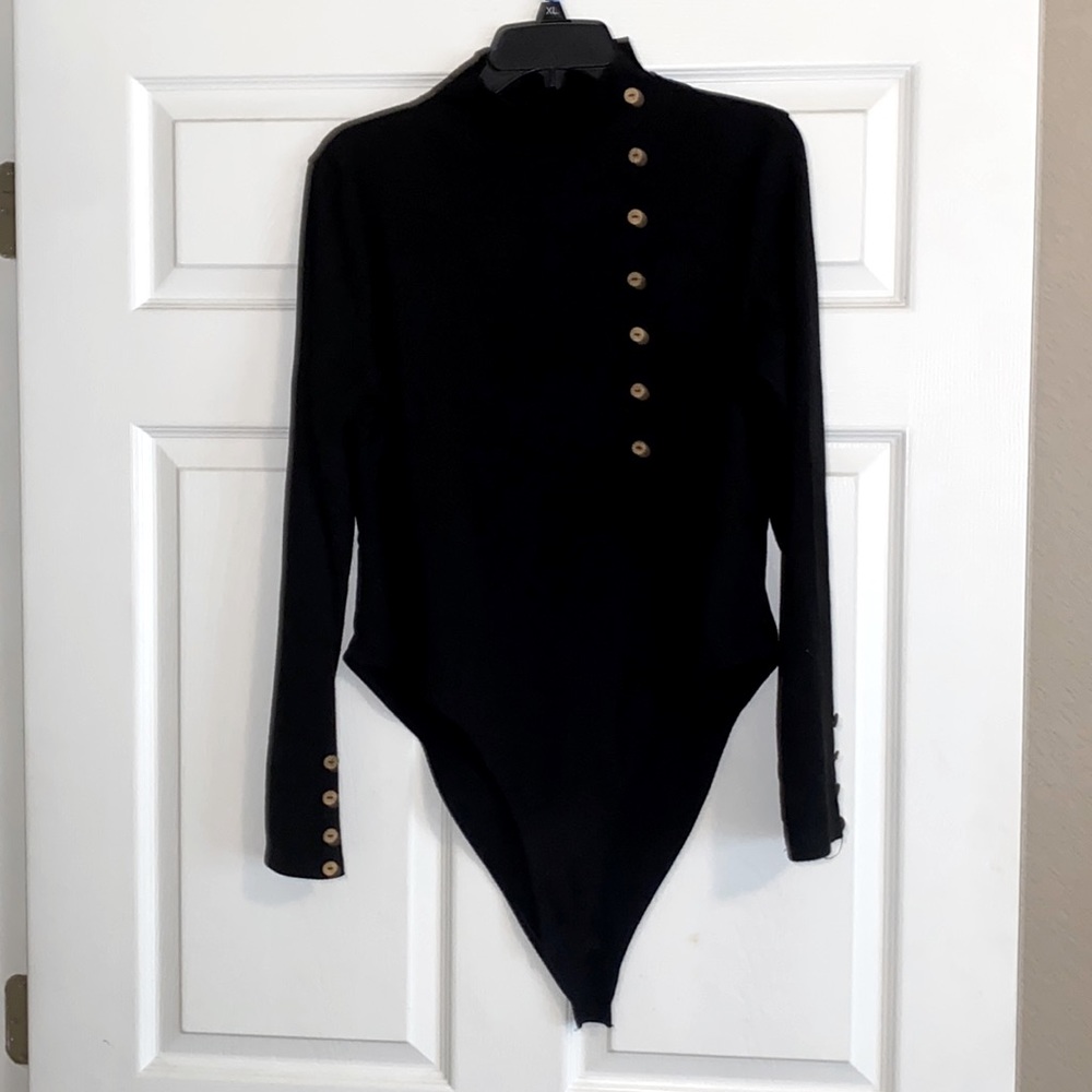 Black ribbed mock turtleneck bodysuit.